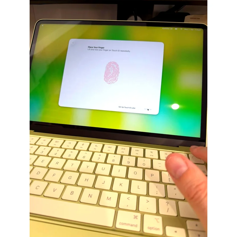 Apple MacBook Neo 13-inch in citrus colour, lid closed, top-down view