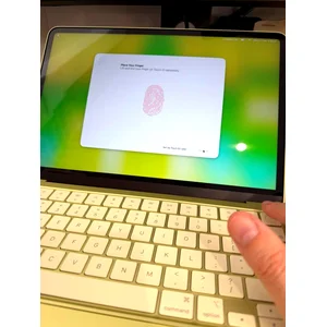 Apple MacBook Neo 13-inch in citrus colour, lid closed, top-down view