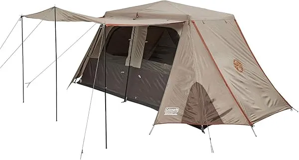 Coleman Instant Up Darkroom 6P tent in Anaconda-exclusive colourway, fly attached, pitched on grass